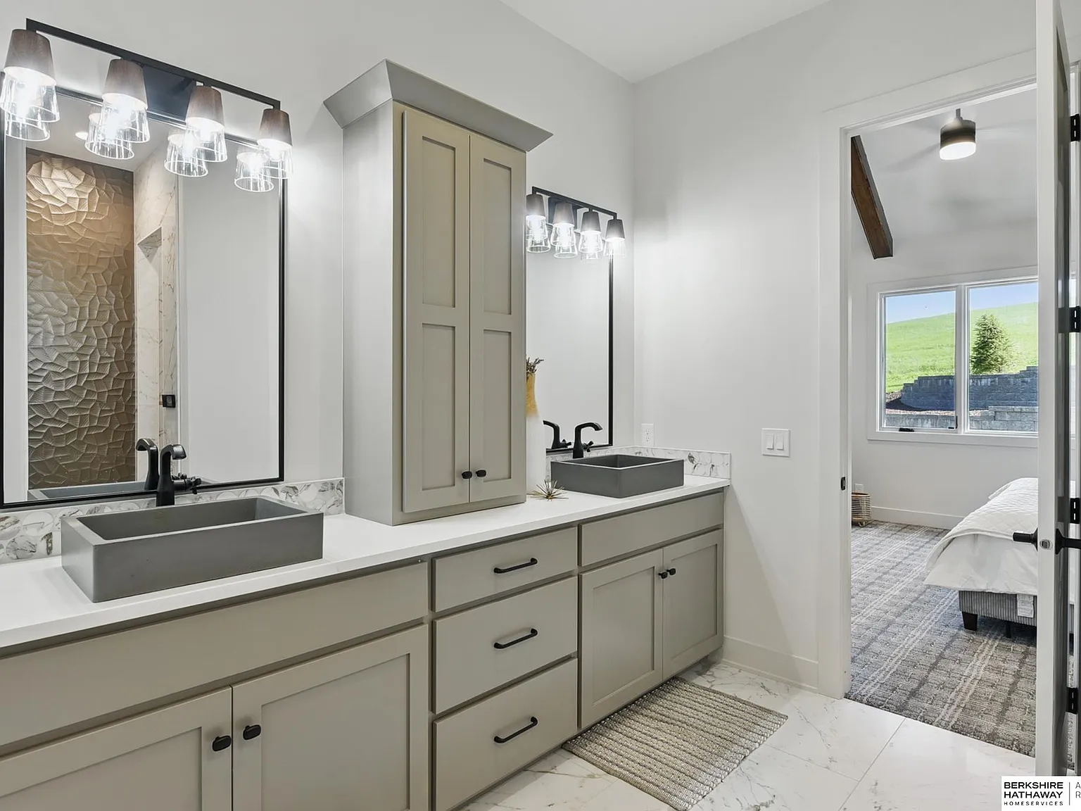 Primary bathroom with dual vessel sink vanity and tiled walk-in shower