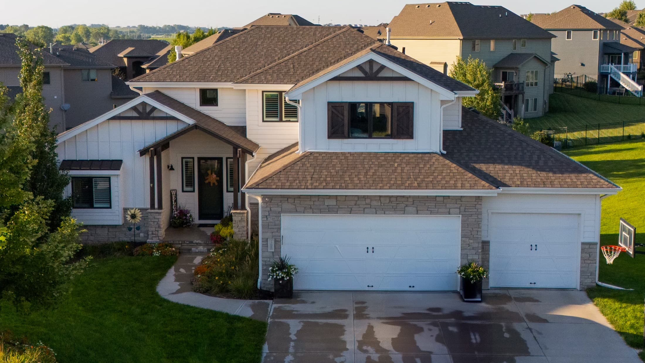Aerial view of a custom-built two-story home in the Omaha metro