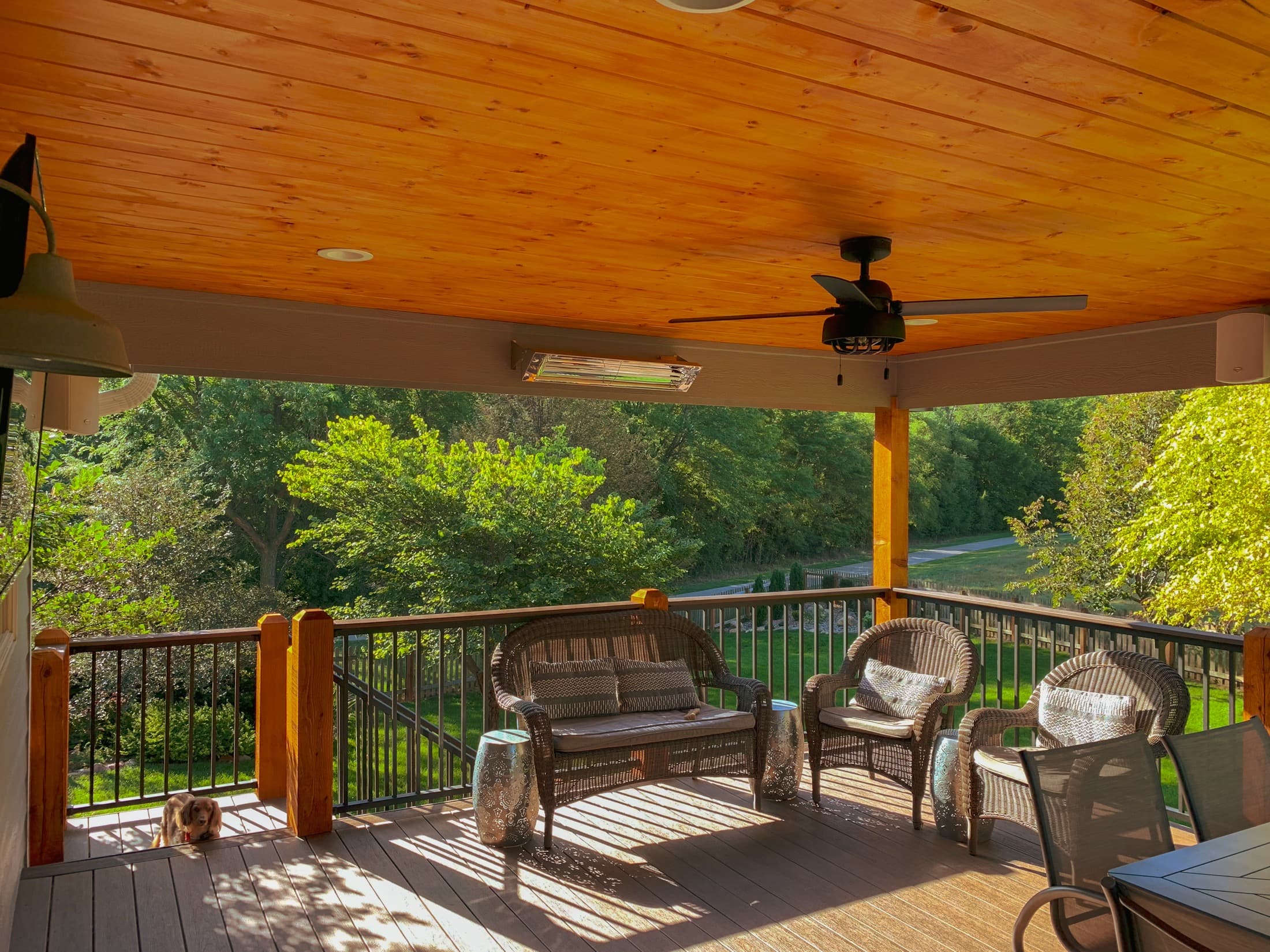 Covered deck with ceiling fan and outdoor seating area